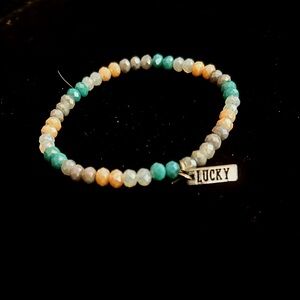 Vibrant Teal Beaded Bracelet with “Lucky” Charm